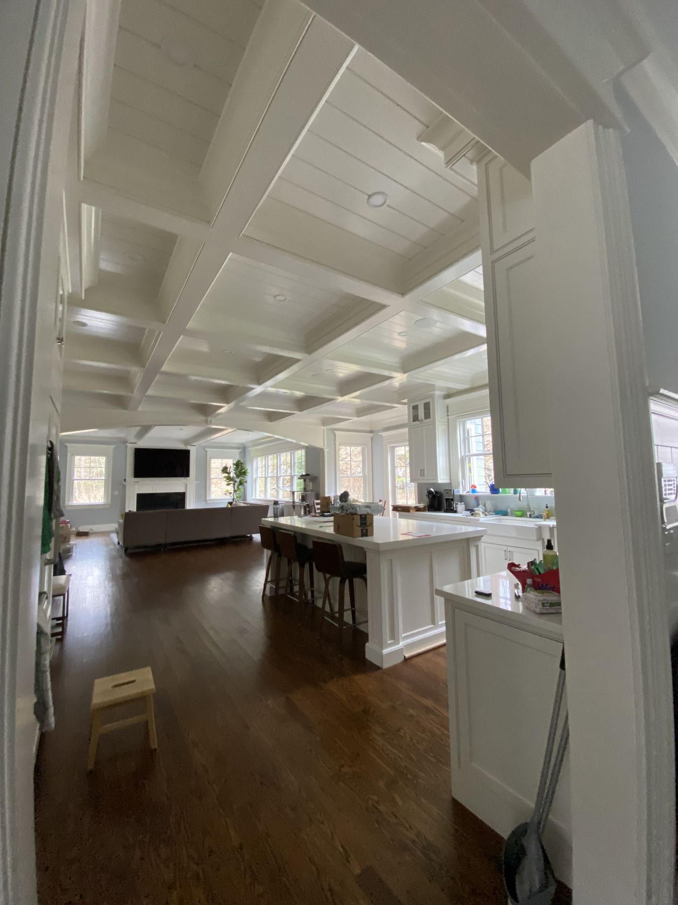 Open kitchen and living space under a beamed ceiling