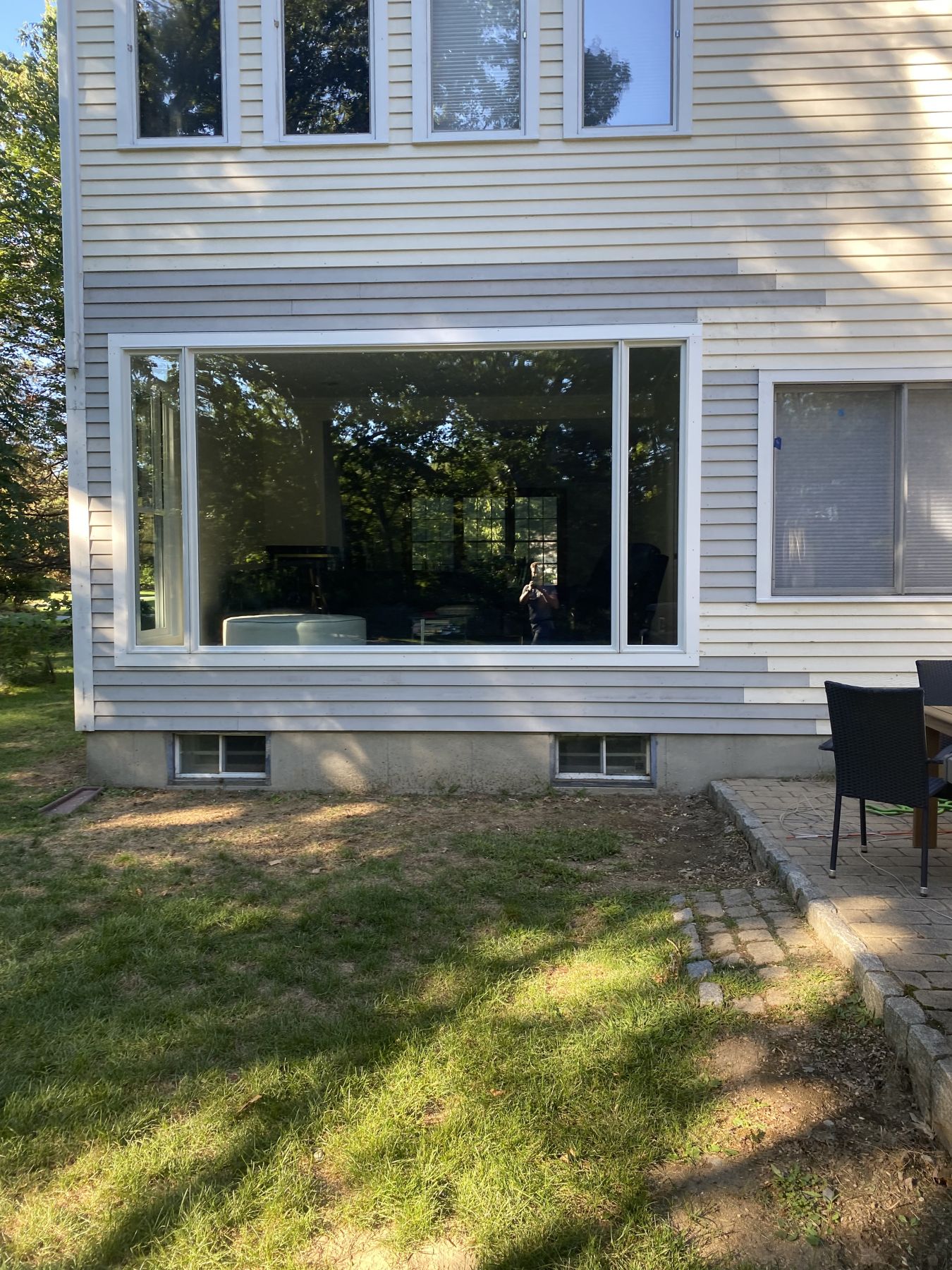 Replacement picture window and casements set into a clapboard wall